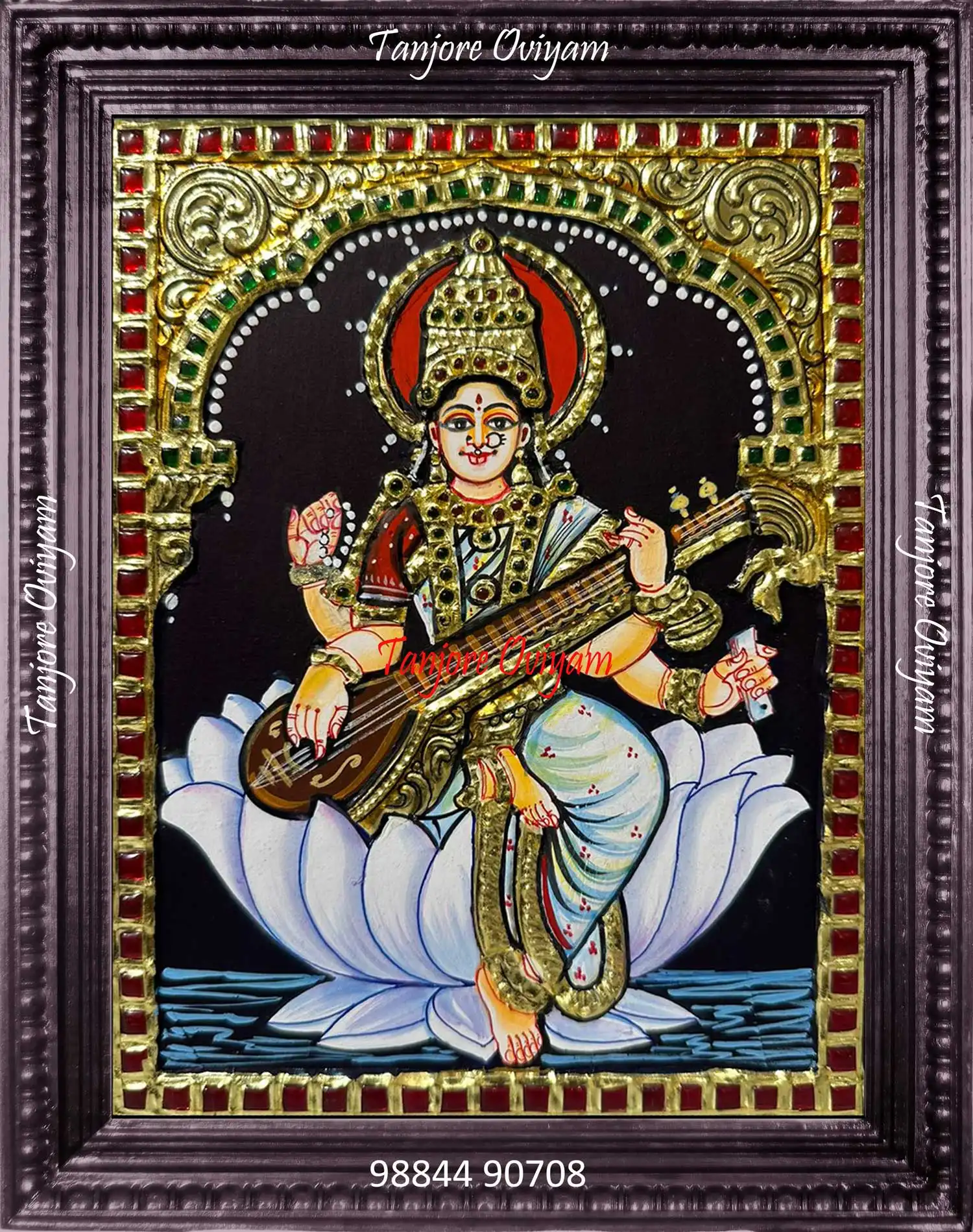 Handcrafted Saraswathi Mata Tanjore painting seated on a lotus with veena and gold foil detailing